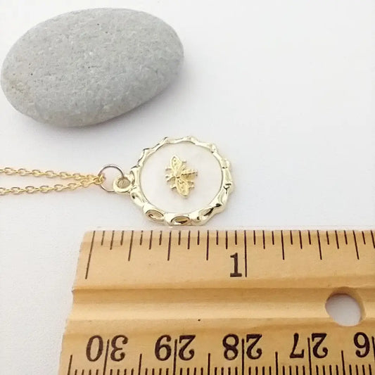 Gold Bee Necklace, White Shell Background, Nature Necklace